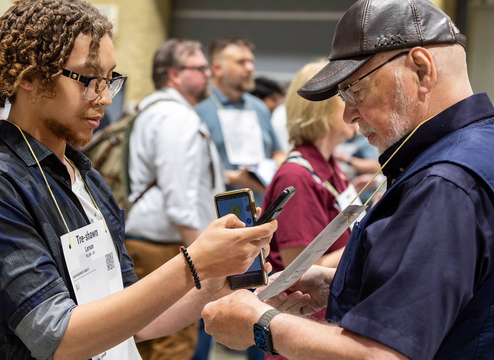 The United We Transform 2024 gathering: an open room with participants working in standing groups